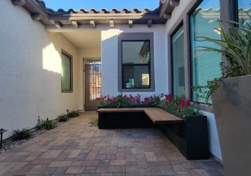 A bench sitting in the middle of a patio.