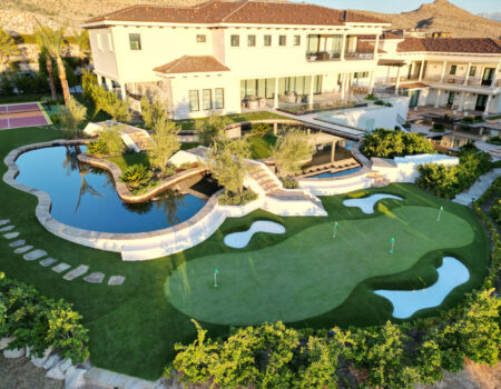 A large pool with a golf course in the middle of it.